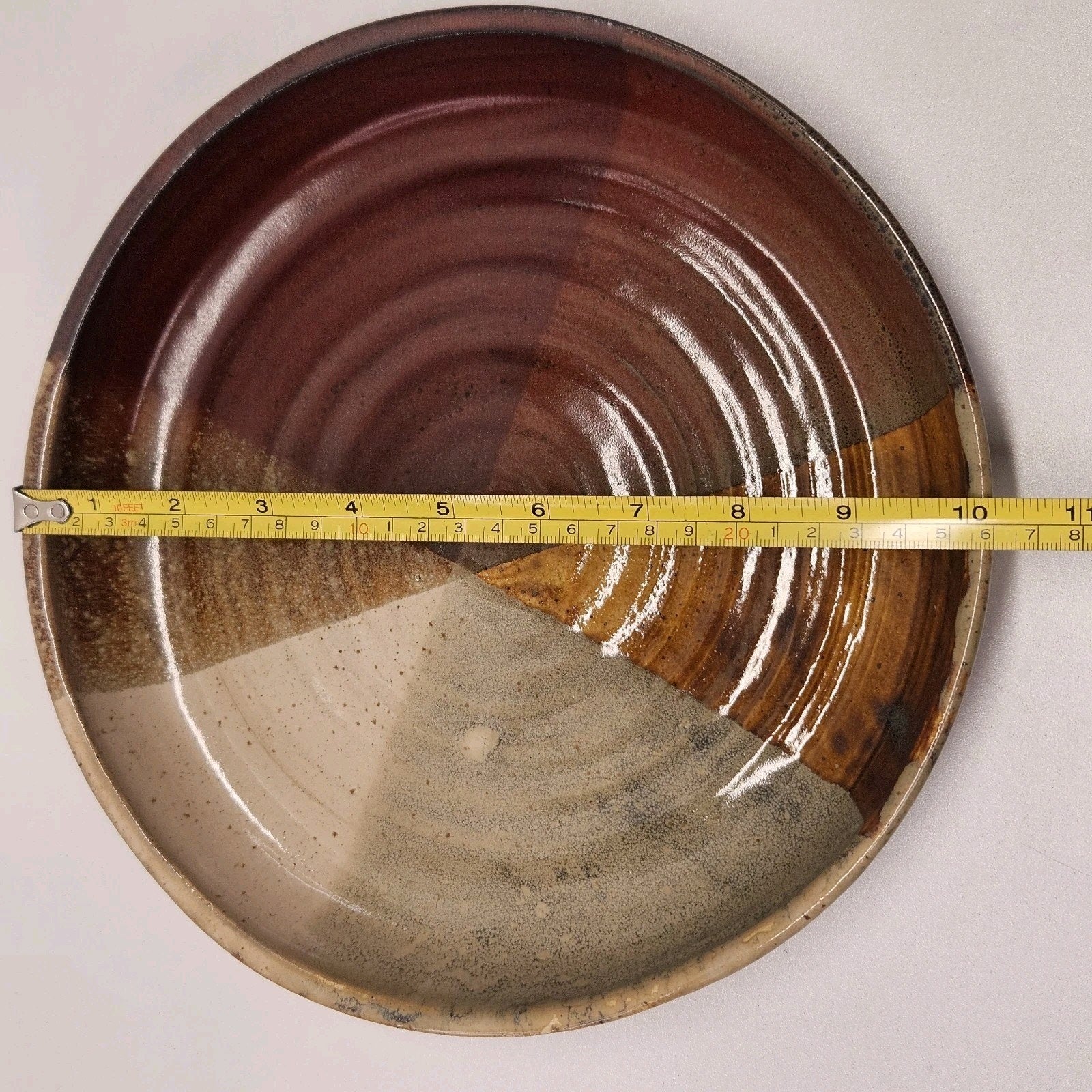 Pottery Plate 10” Brown Red Tan Glazed Dish Stamped Hand Thrown Artist Signed